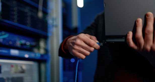 A close up of a cybersecurity expert typing on their keyboard.