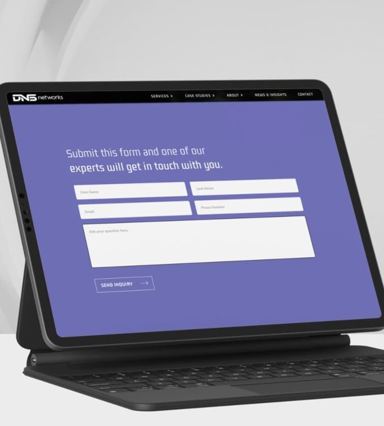 Website mockup of DNSnetworks on a tablet laptop