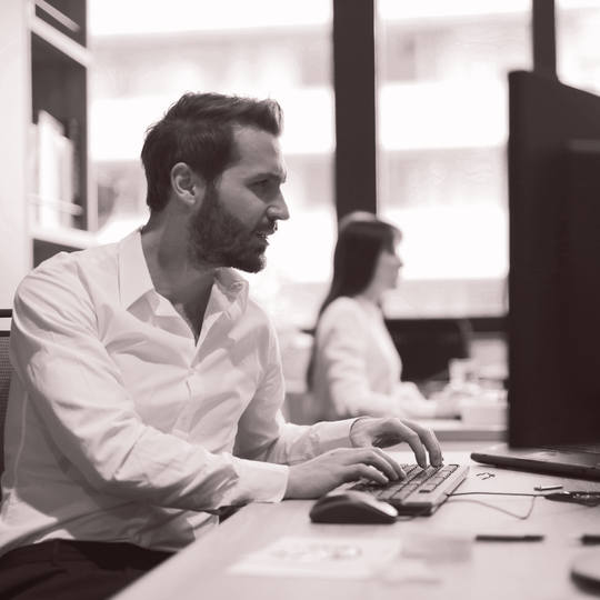 person working hard on computer