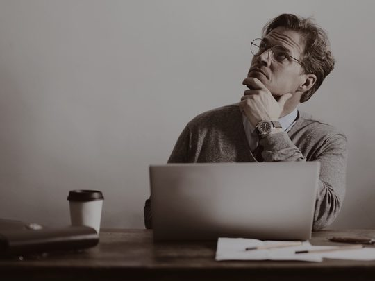 person on laptop looking up